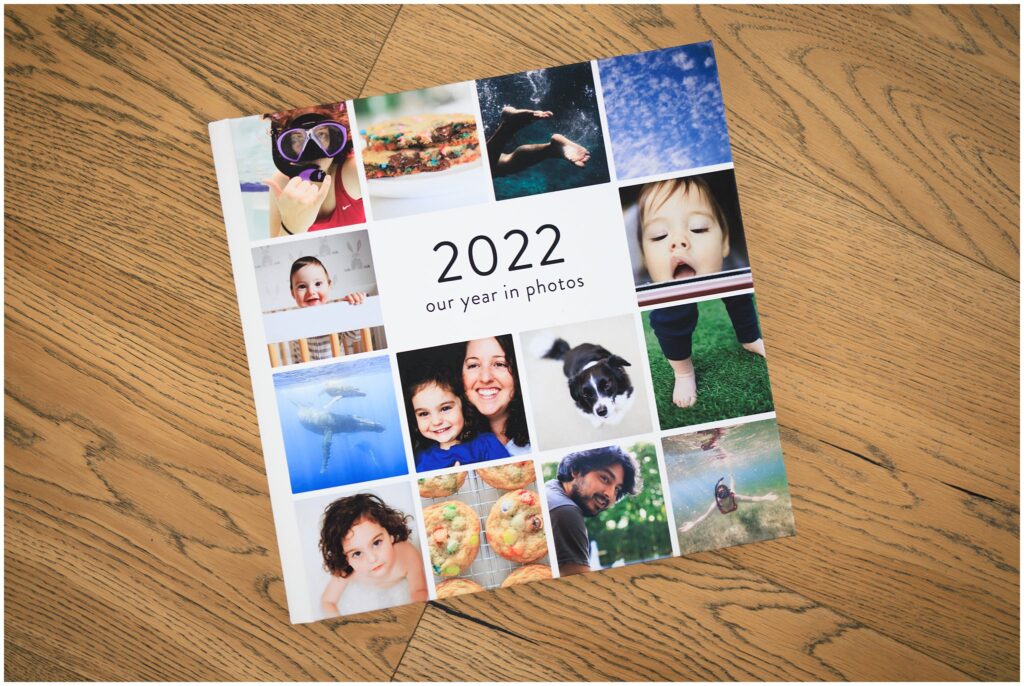 Image of a photo album with a collage cover featuring a variety of images and the title, "2022 Our Year In Photos."
